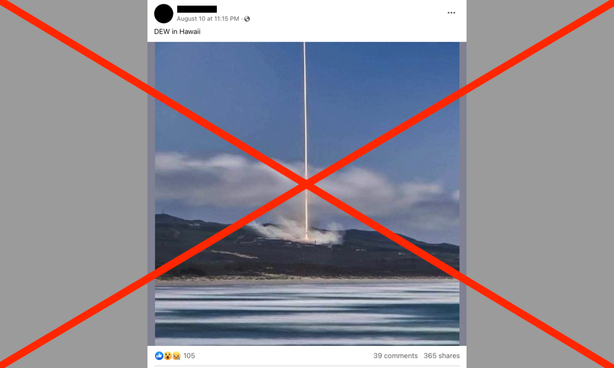 Facebook post showing beam of light hitting island with water in the foreground and red cross over the image