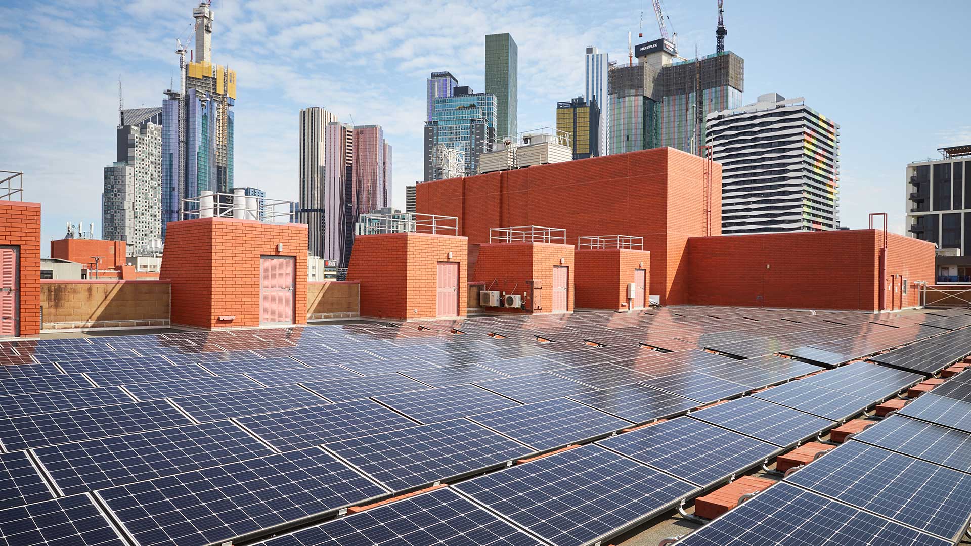 Image of solar panels on a city roof
