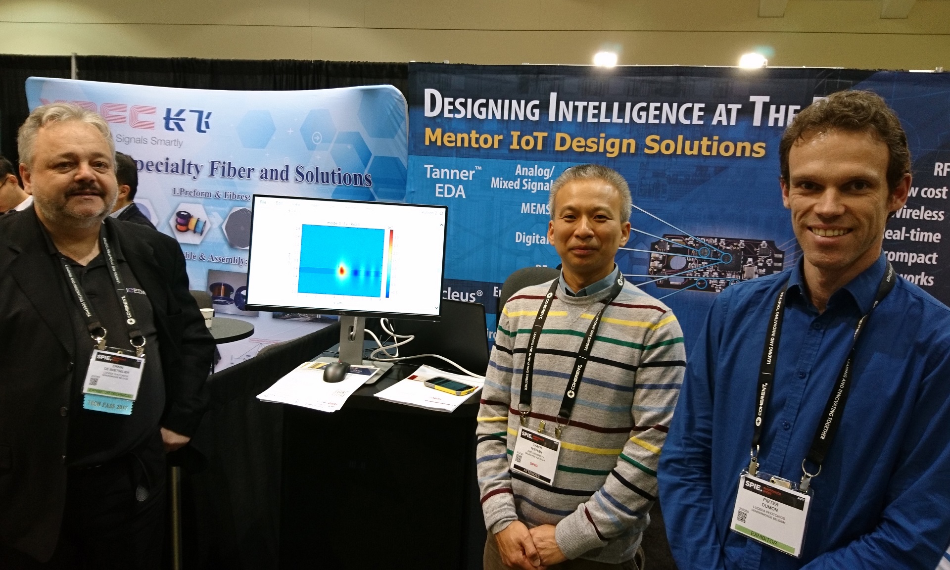 Senior Lecturer Dr Thach Nguyen (centre) with the Luceda team at the Photonics West conference in San Francisco where REME was launched.