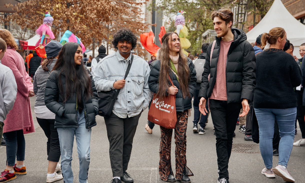 Four students at NextFest walking down Bowen street