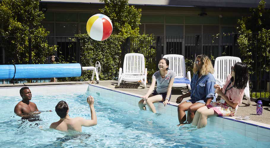 Image of students in pool playing with a ball