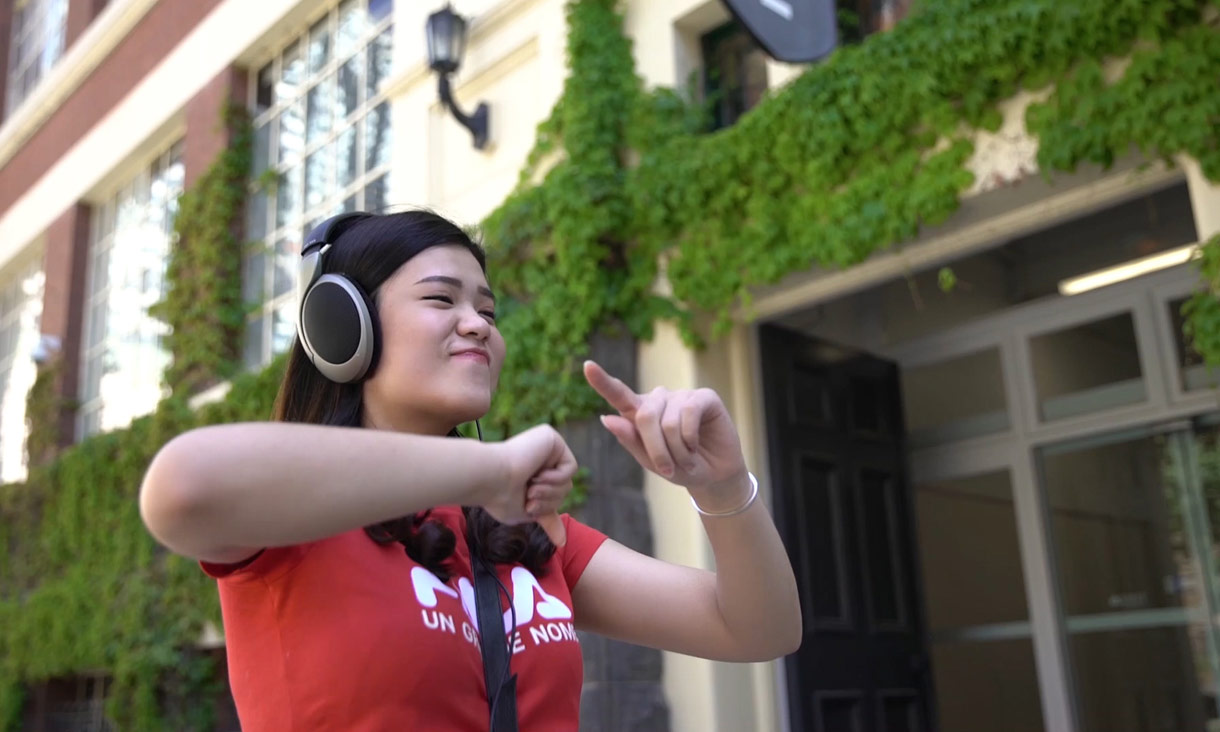 Student dancing with headphones on