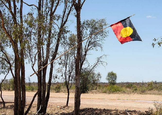 Aboriginal flag flown in protest at Bravus mine site.jpg