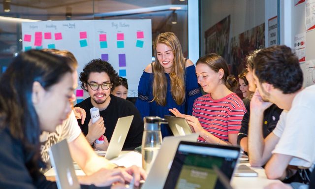 Students working around a table