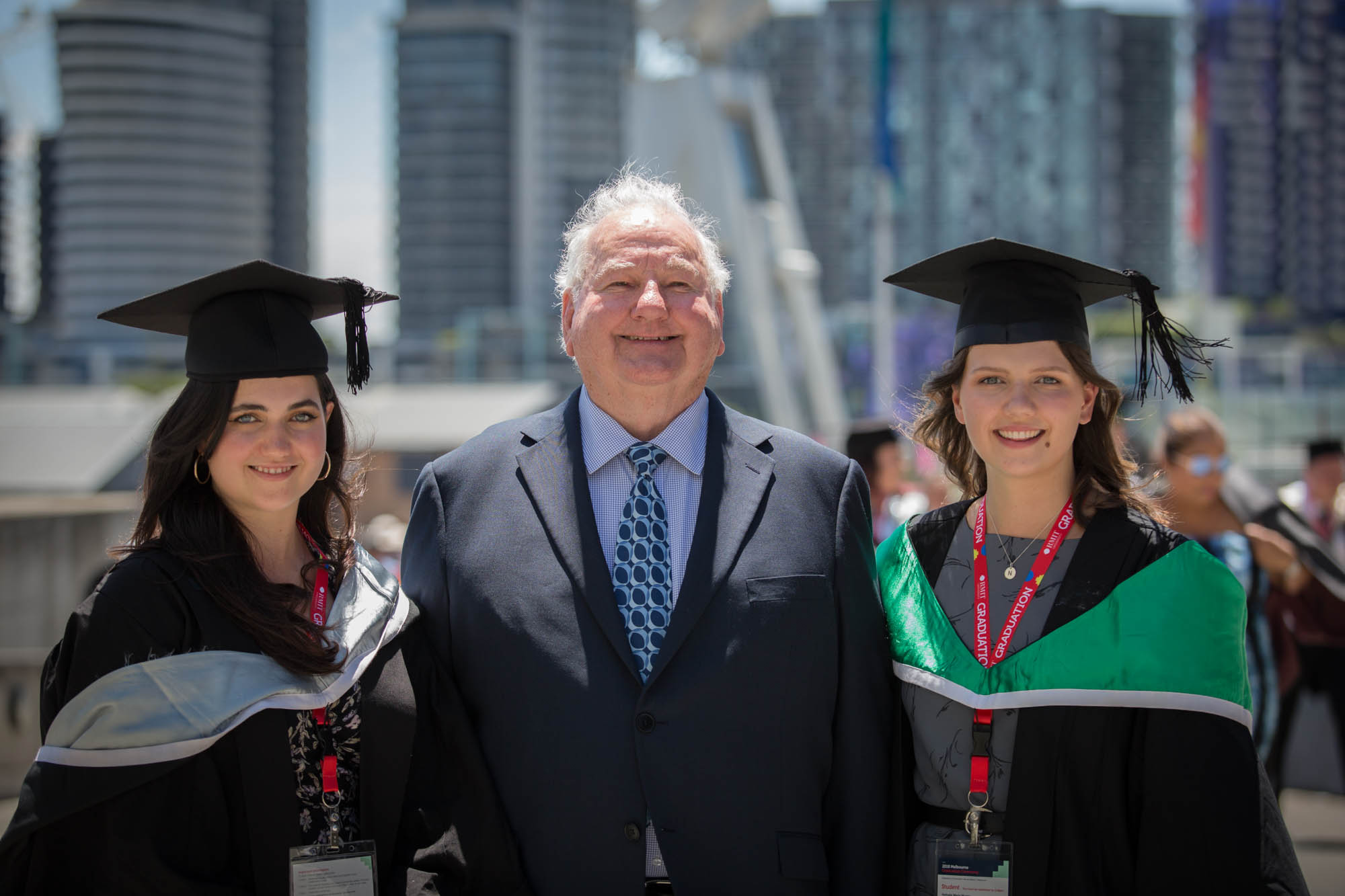 RMIT alumnus Peter Murray with graduating granddaughters Madeleine and Nathalie