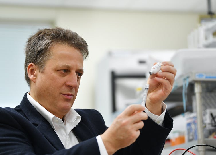 Professor Nikolai Petrovsky, of Vaxine and Flinders University, with the COVID-19 vaccine candidate. It was the first Australian-developed vaccine to enter phase 1 human trials, on July 1. David Maruiz/AAP