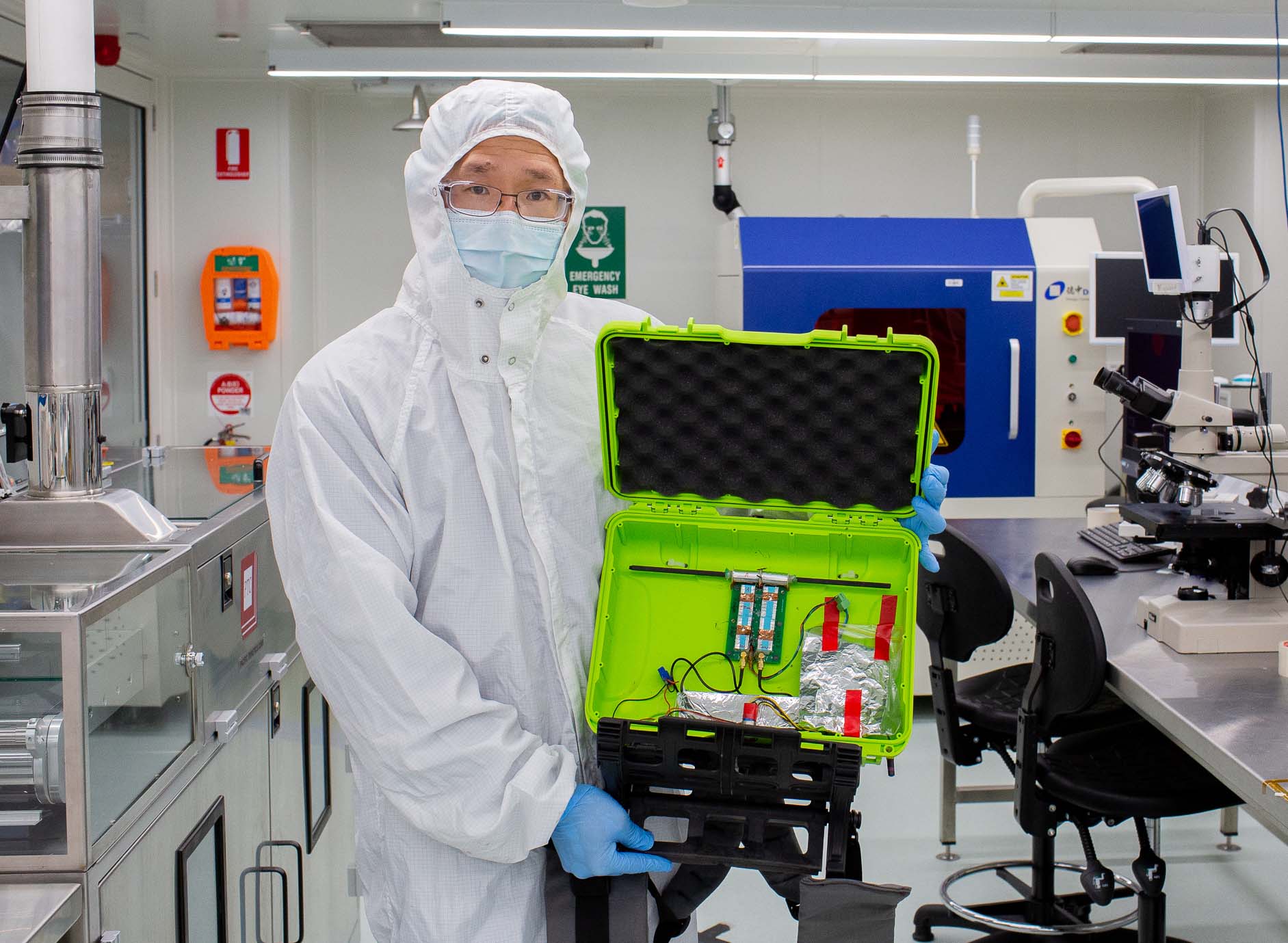Lab technician holds MAPrad prototype in the Micro Nano Research Facility clean rooms at RMIT.