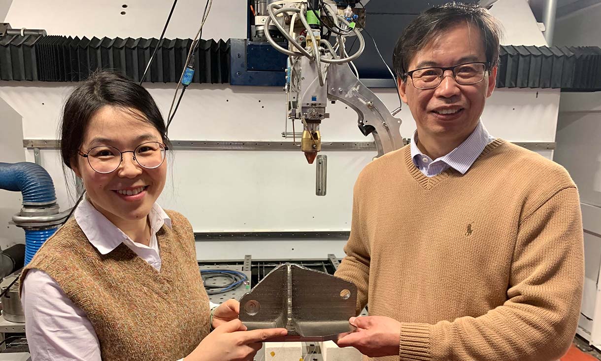 Team members Dr Tingting Song and Professor Ma Qian (left to right) with a titanium alloy part created with the laser 3D printer that the team used at RMIT University. (Note: this is not an alloy part that the team made for this research.) Credit: RMIT