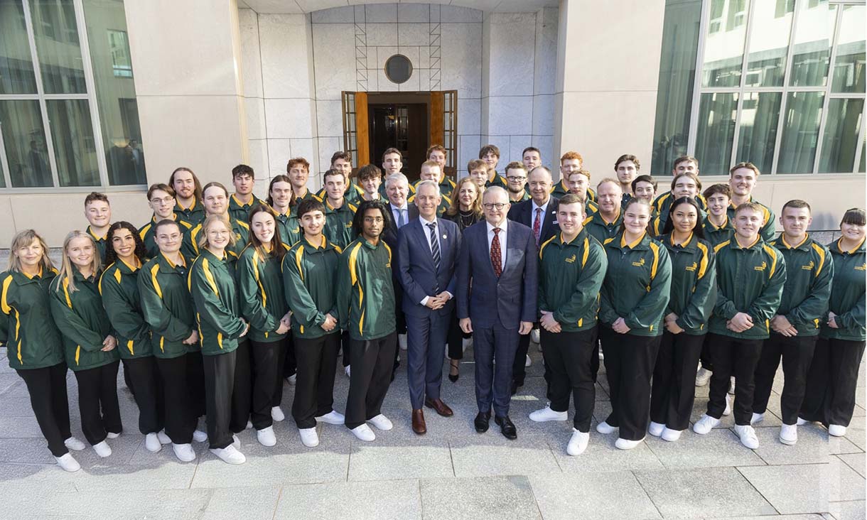 WorldSkills students standing in a group around Prime Minister Anthony Albanese. They're all facing the camera and smiling.