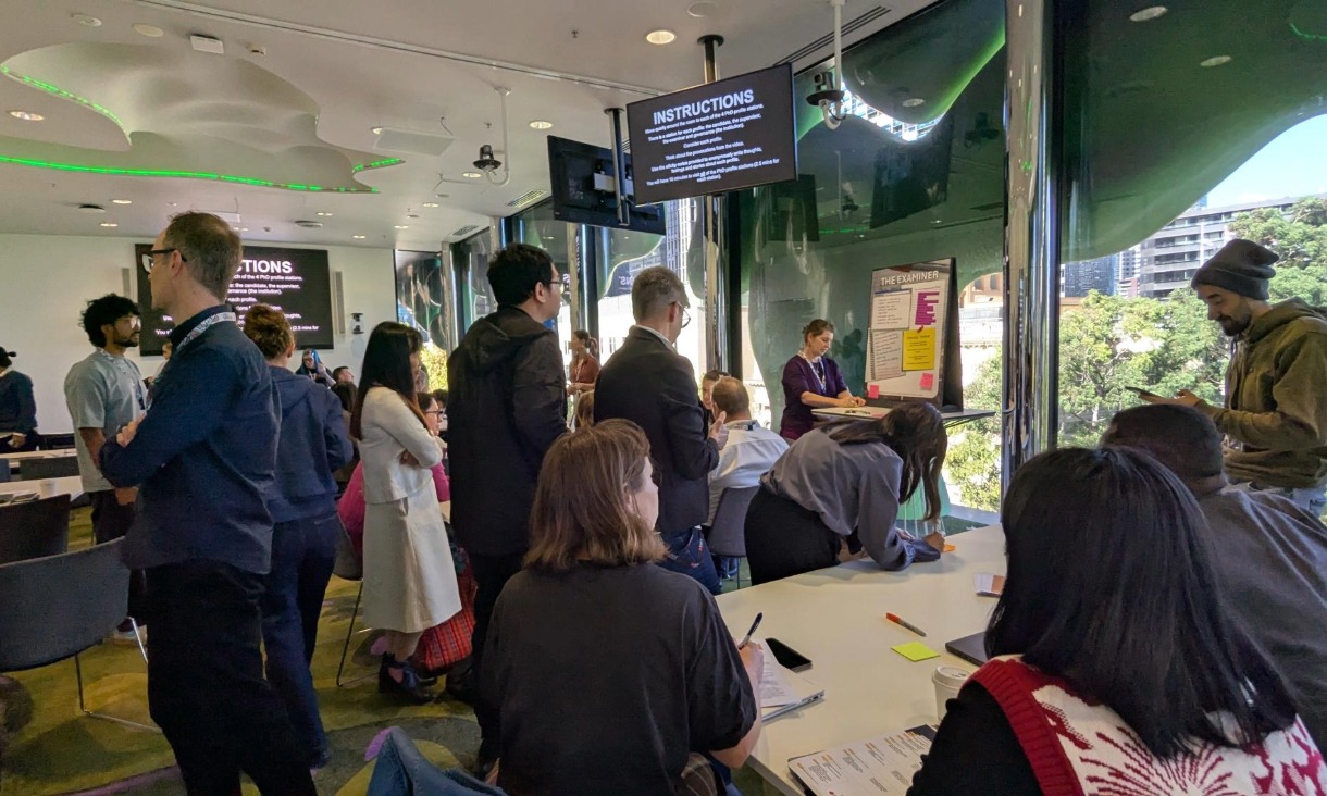 Participants moved around the room, adding reflections on sticky notes for each archetype. 