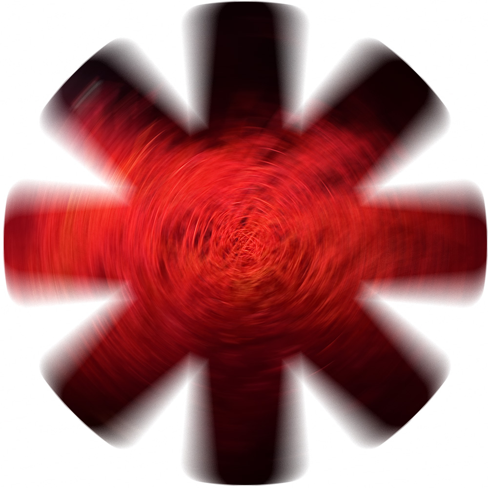 Blurred red and black petals form a flower-like spiral. 