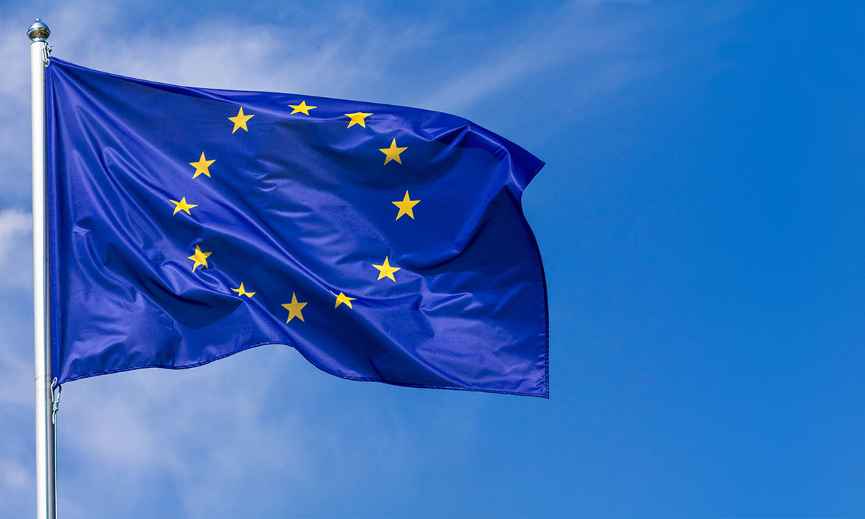 A European Union flag flying in the wind