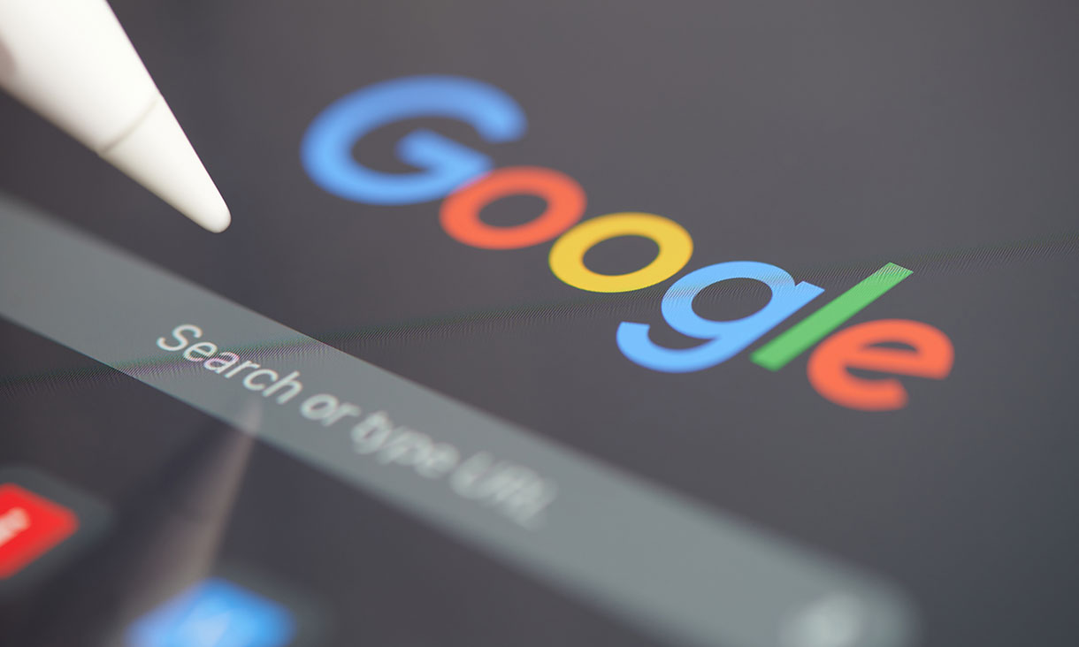 A pen hovering above a Google search panel on an iPad