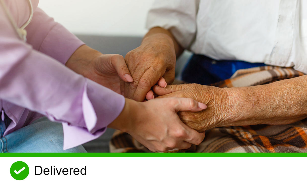 Two pairs of hands holding