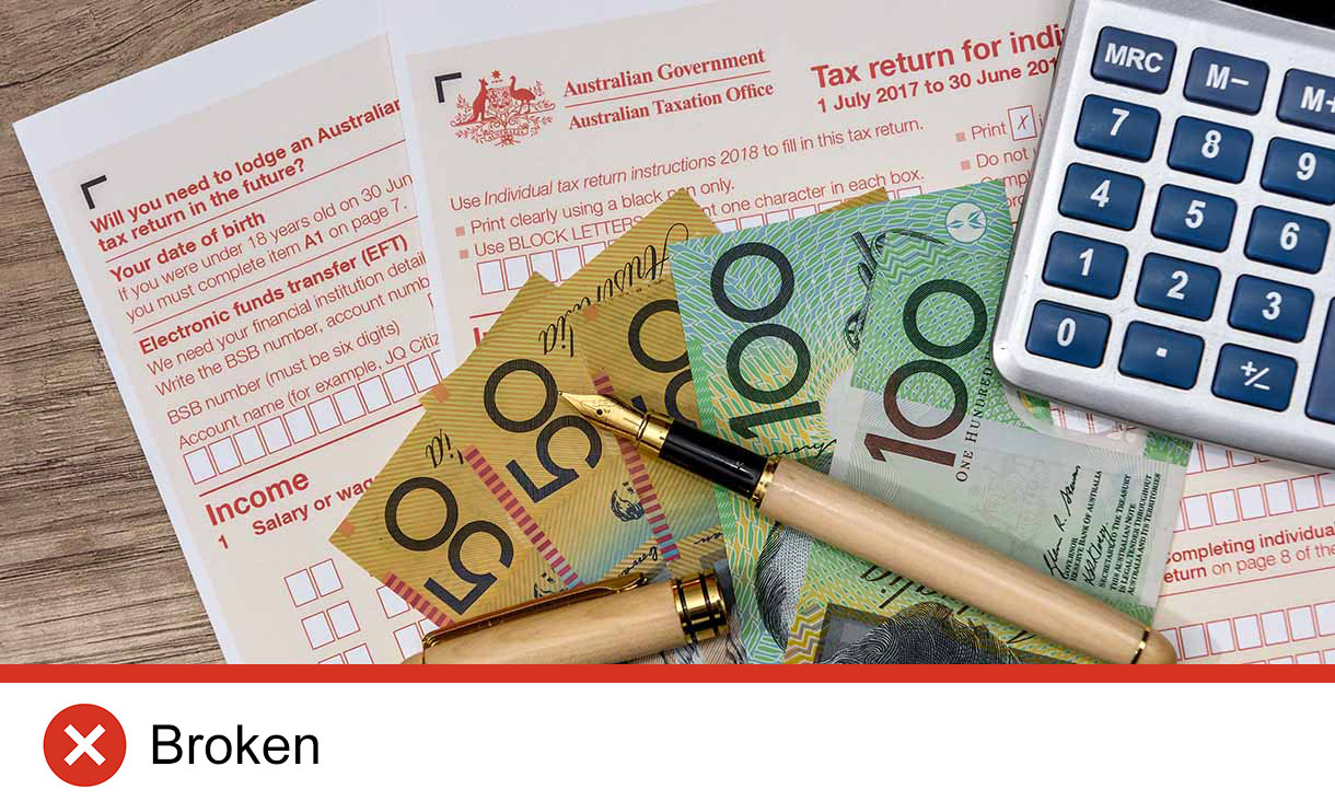 Cash, pen, calculator and tax return forms