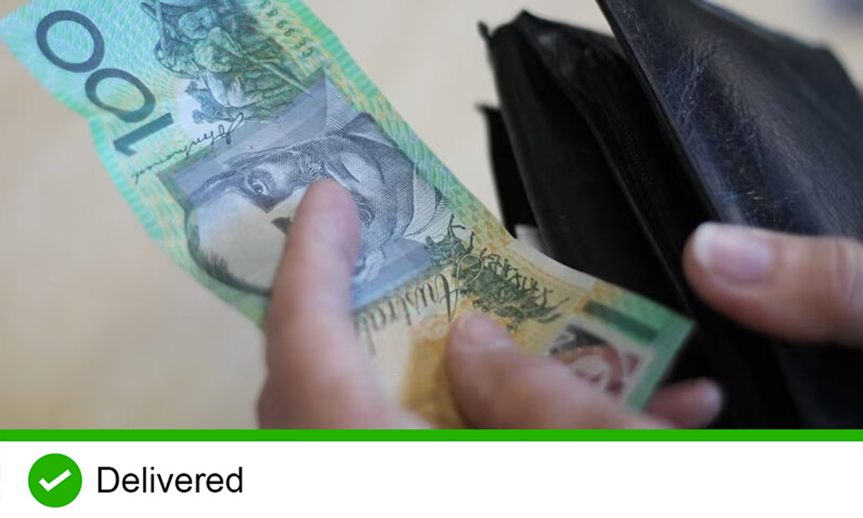 Hand pulling out one hundred dollar note