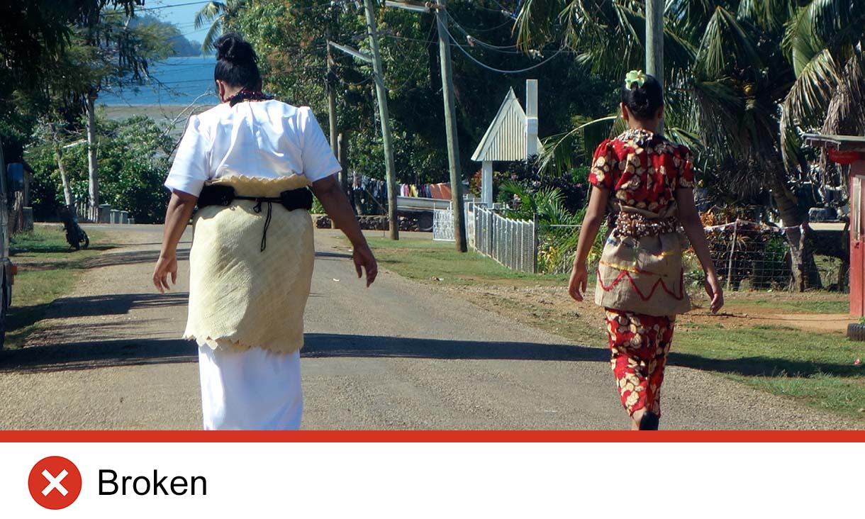 Two people walking from behind