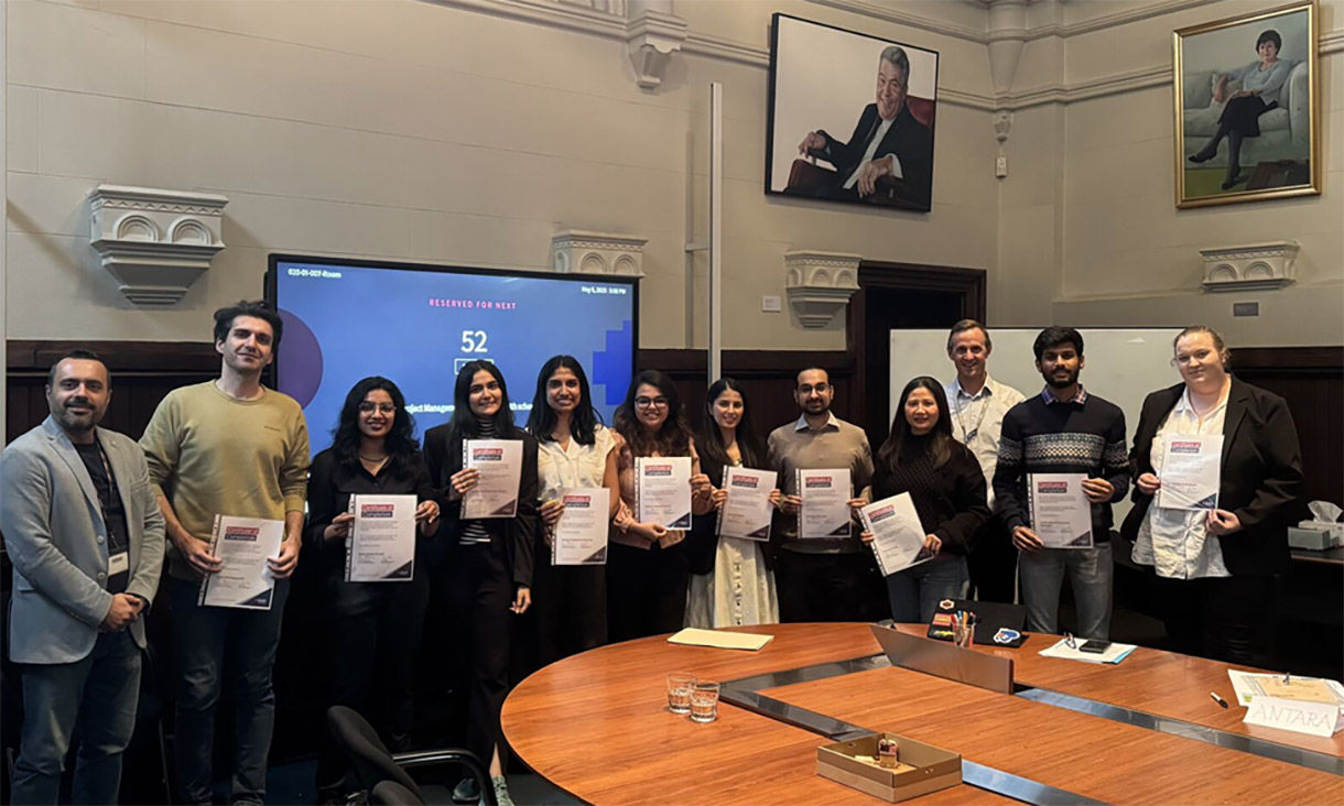 Students’ end of event group photo with their certificates of completion.