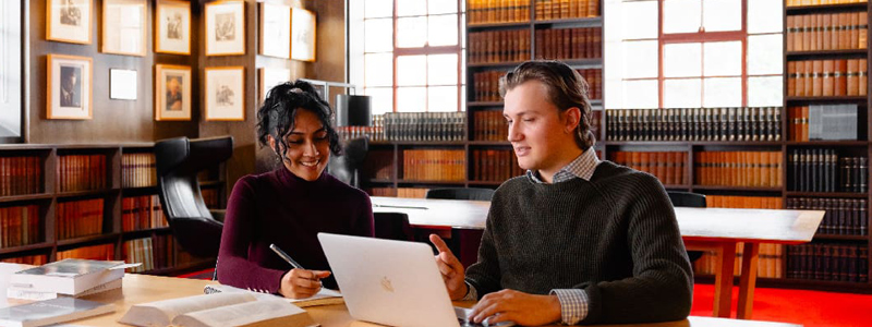 Photo of two students in Justice Smith Reading Room