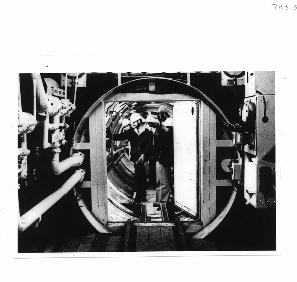 Civil Engineering Students Inspecting Rail Loop Air Lock, c1977. (Image credit: RMIT University Archives)