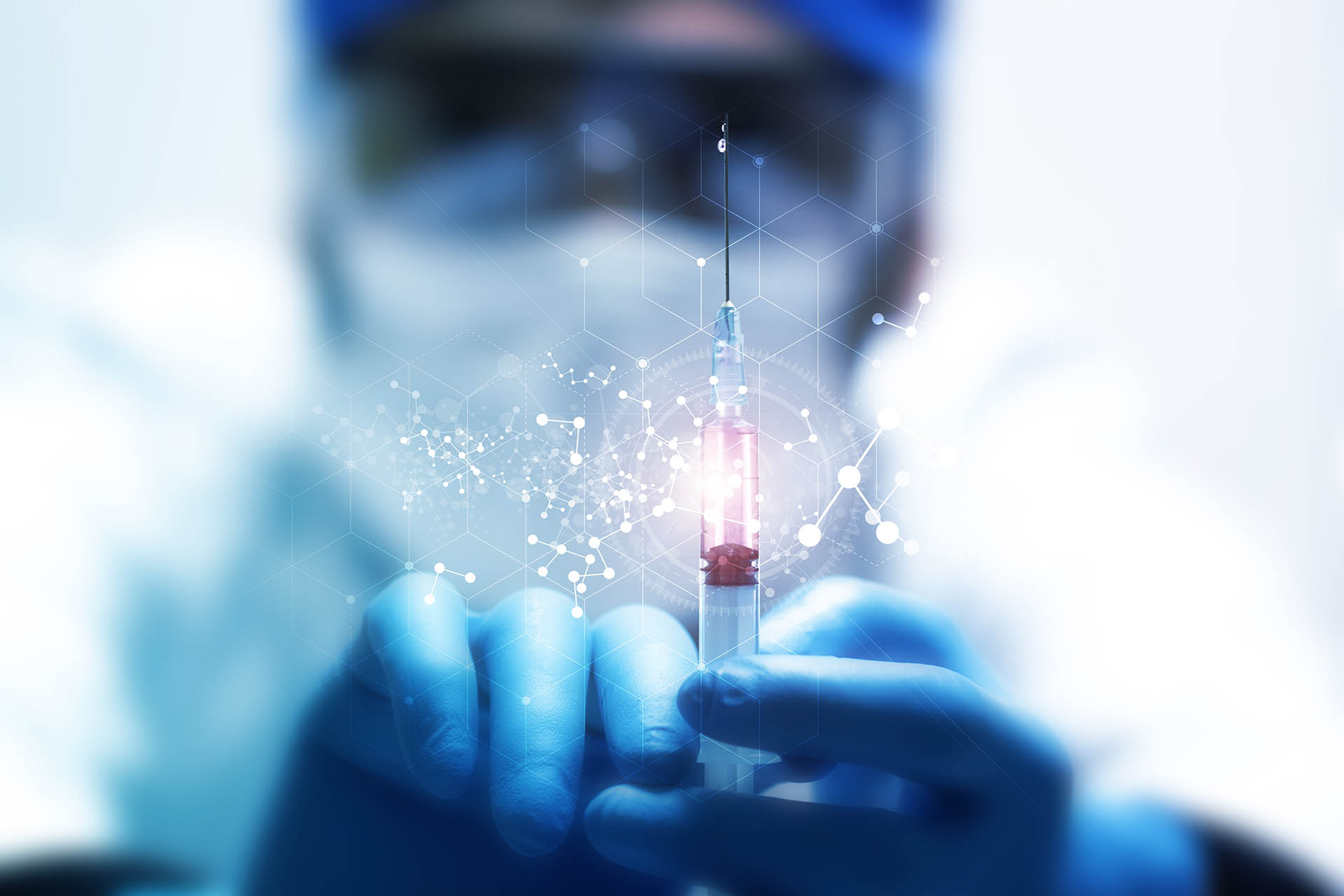 Scientist holding syringe