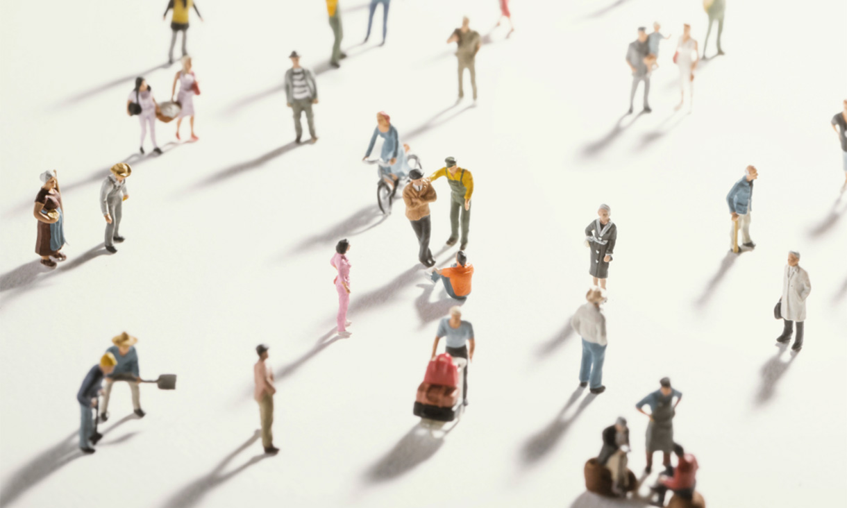 Image of various small people walking around.