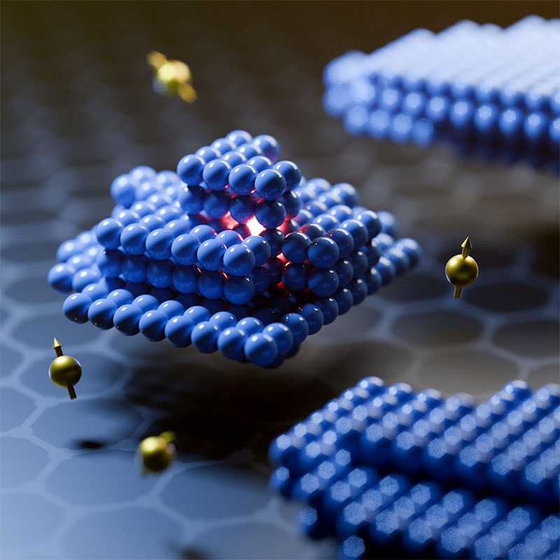 Blue clusters of spheres arranged in a geometric pattern, representing nanoscale materials with glowing red light at their core and floating golden spheres, set on a patterned surface.