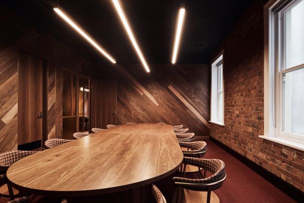 Wood-panelled and exposed brick meeting room at the Oxford Scholar Hotel.