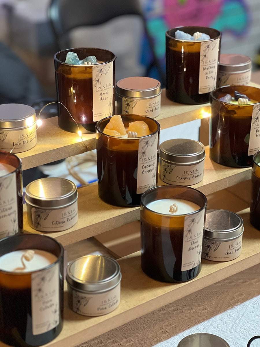 scented candles and oils sitting on small shelves