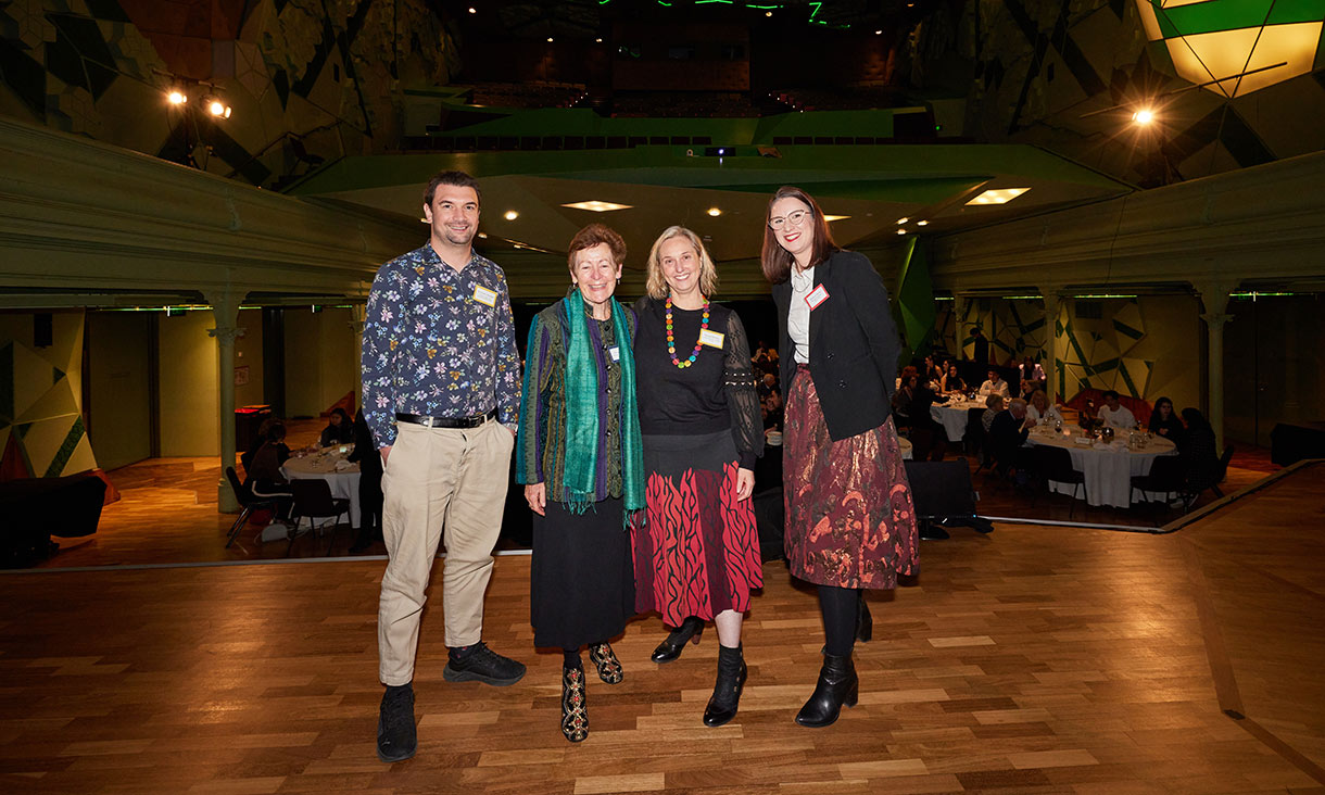Four people on stage at the 2025 RMIT Scholarship Dinner