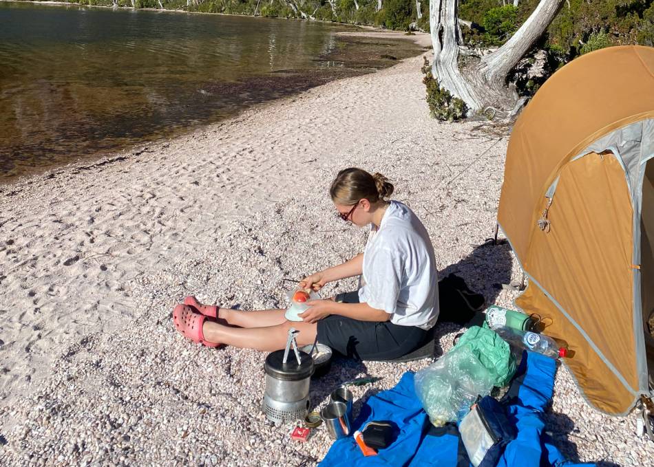 Image of Mijawi Mansell White Bear sitting on the sand.