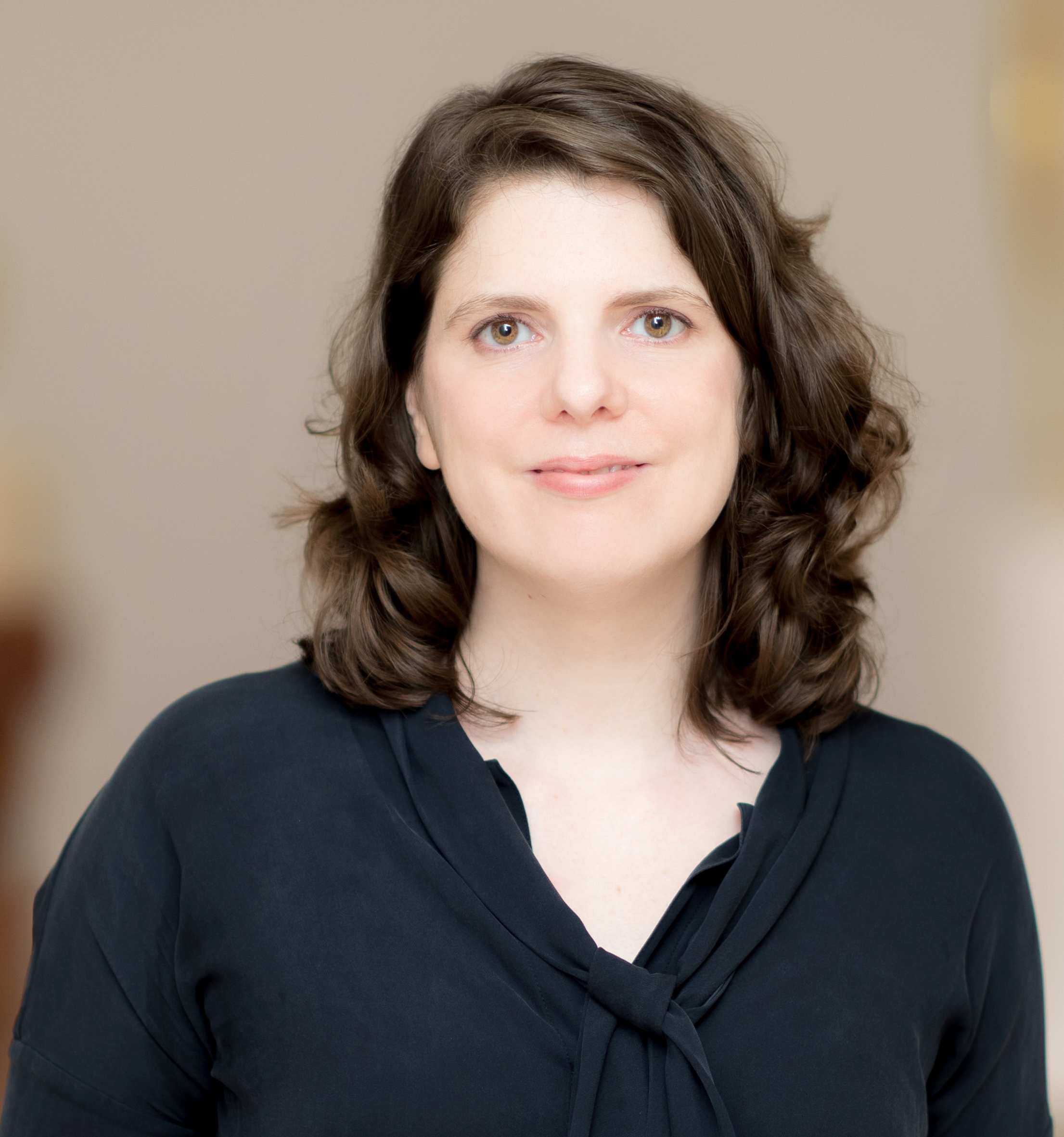 A woman with shoulder length brown hair
