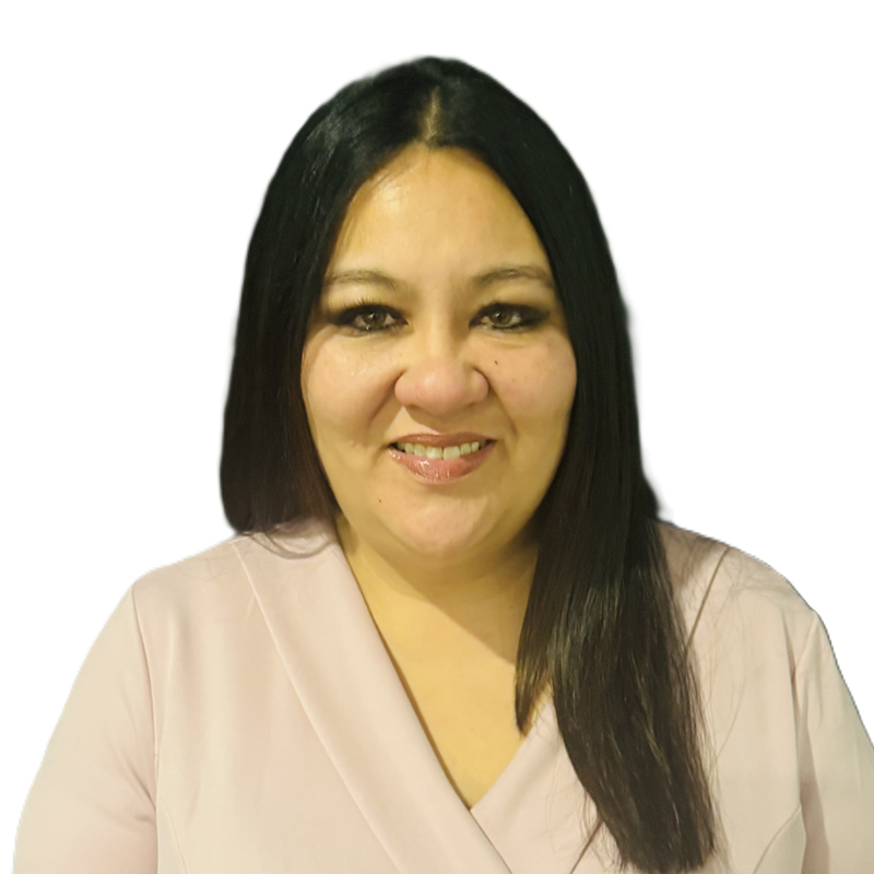 Photograph of Carmen. She smiles directly at the camera. She has long, black hair and wears a cream-coloured shirt.