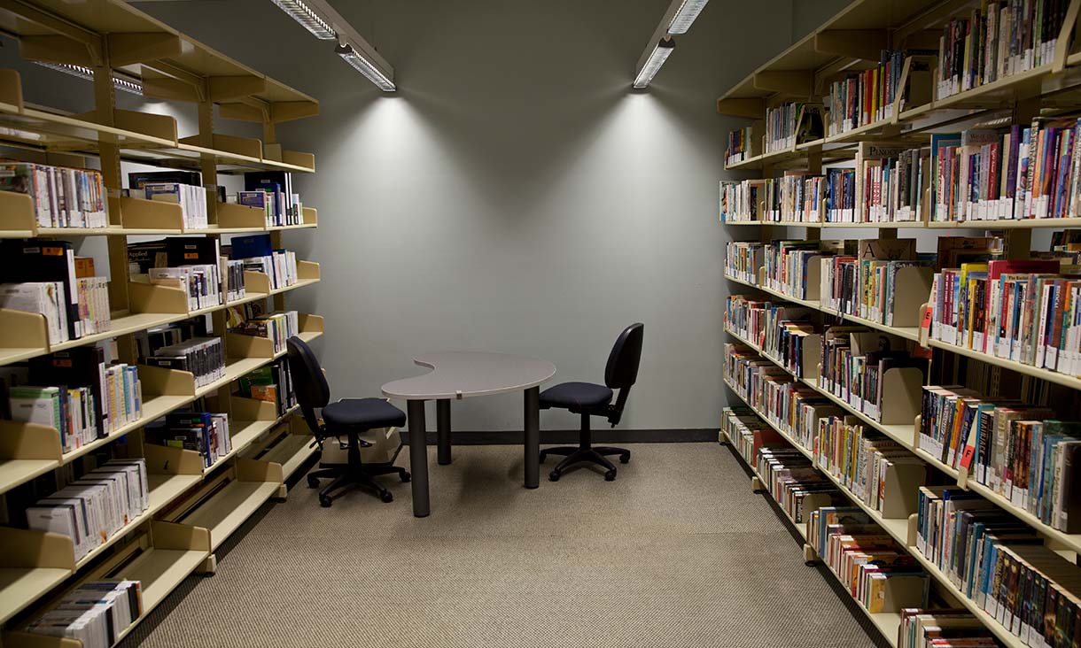 Bundoora Library collection area with a study table.