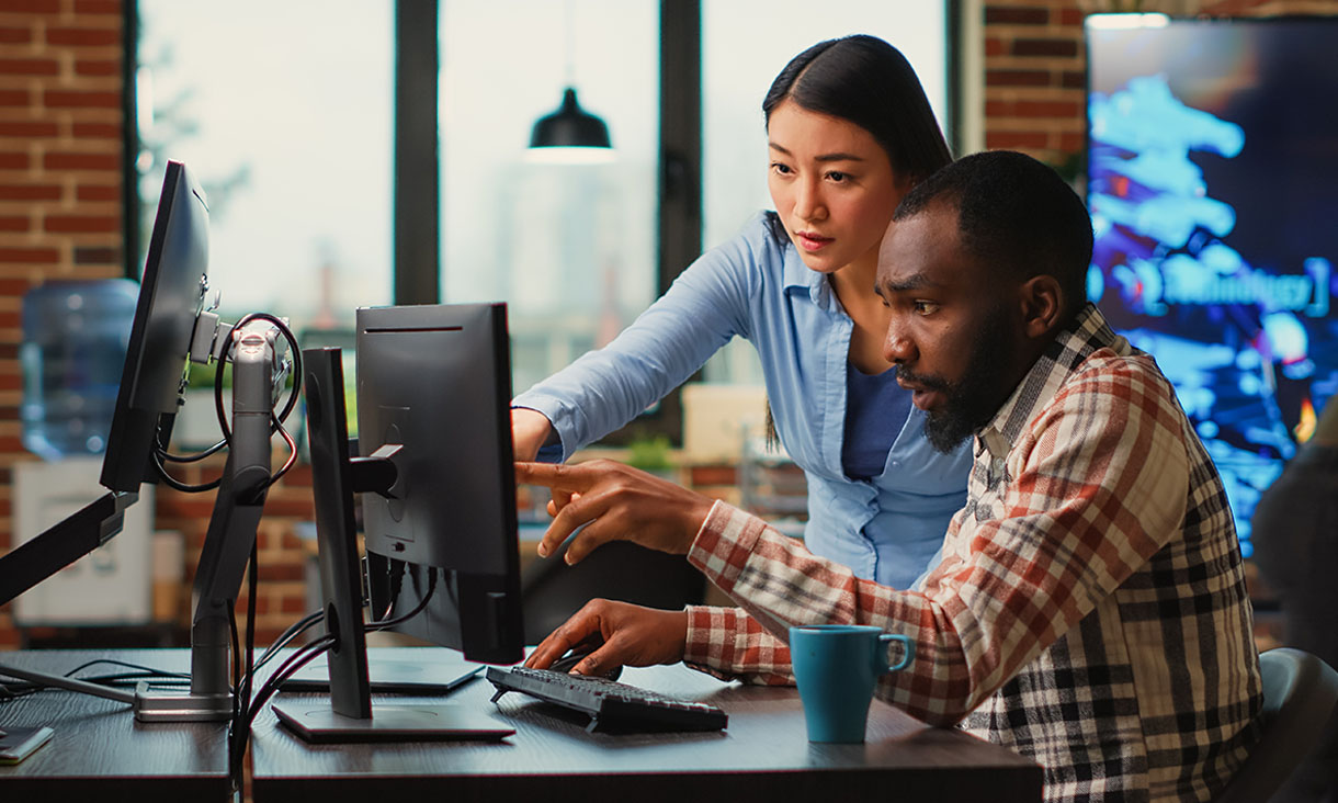 Man and woman working at computer