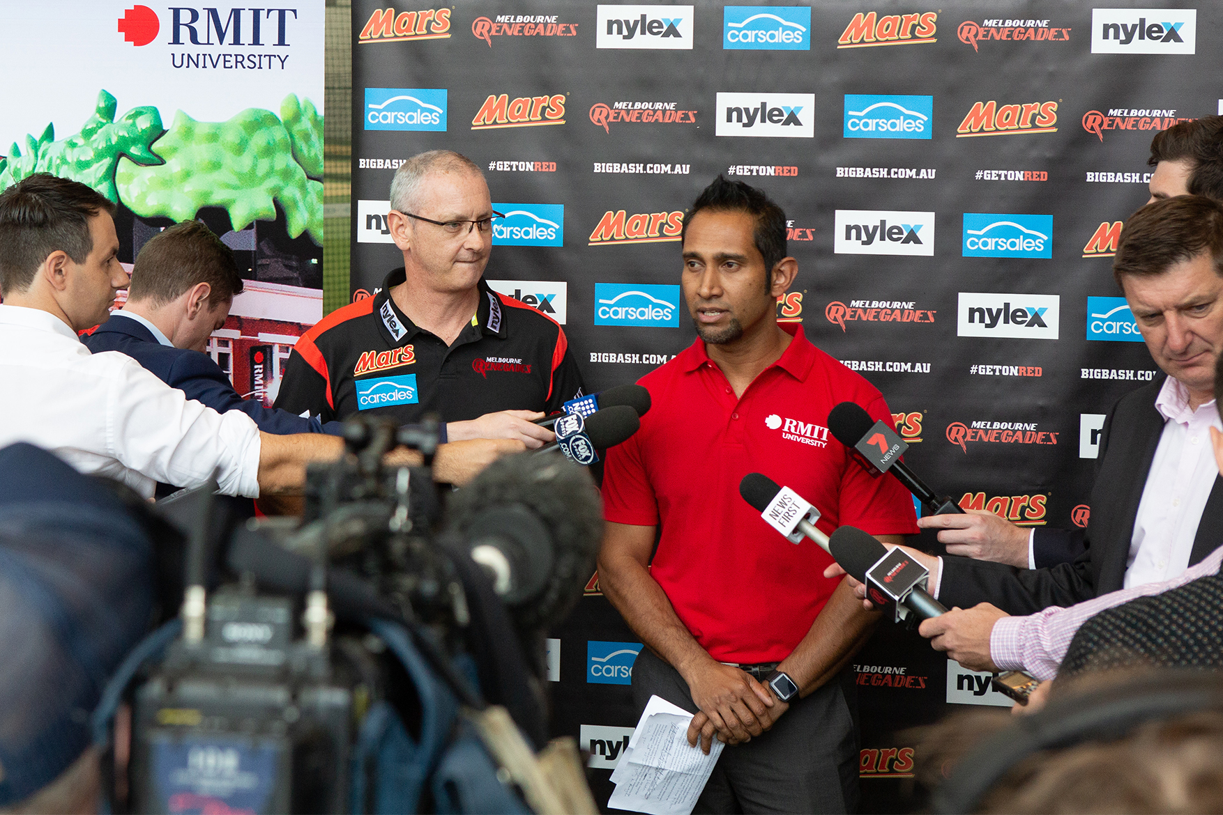 John Thangarajah speaking at a RMIT and Renegades press conference