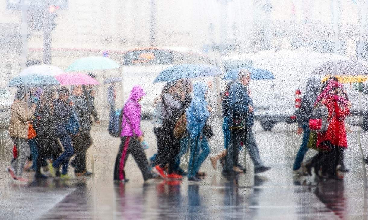 People crossing road during the rain