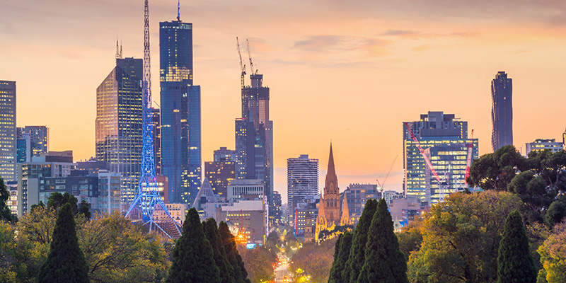 City landscape photograph of Melbourne during an orange sunset.