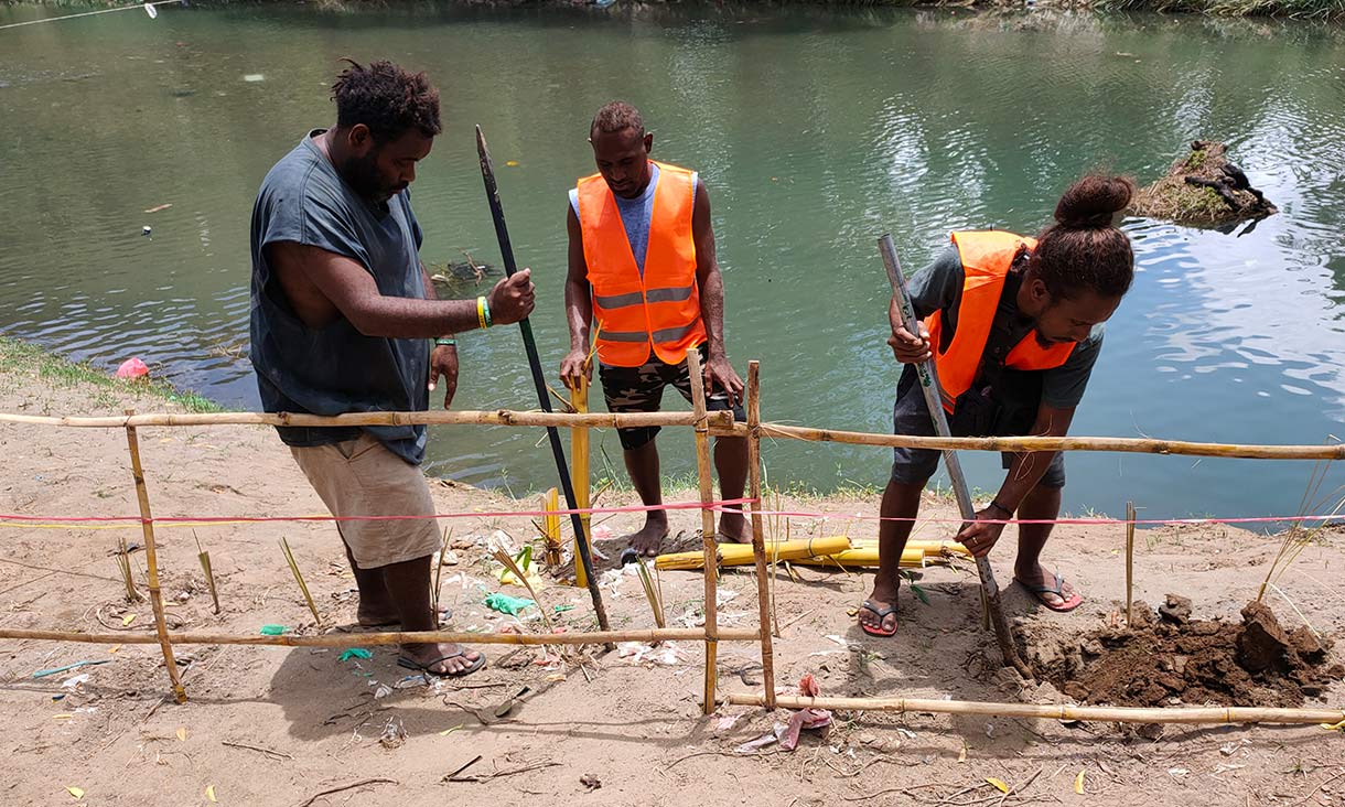 Fencing installation on the riverbank