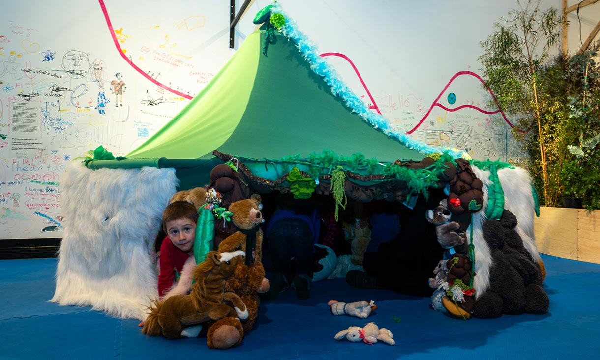 children playing in a green tent at the sensorium