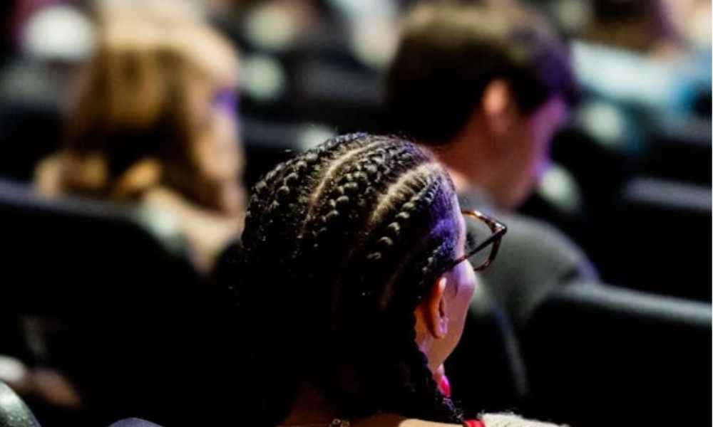 Shot from behind people's heads at lecture theatre