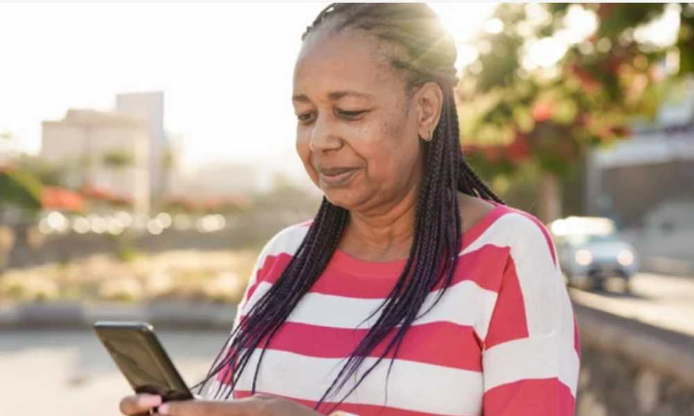 Person looking at their phone outside