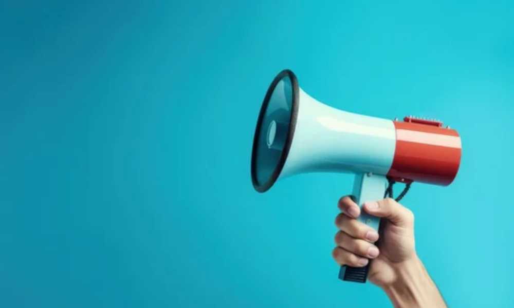 Hand holding loud speaker