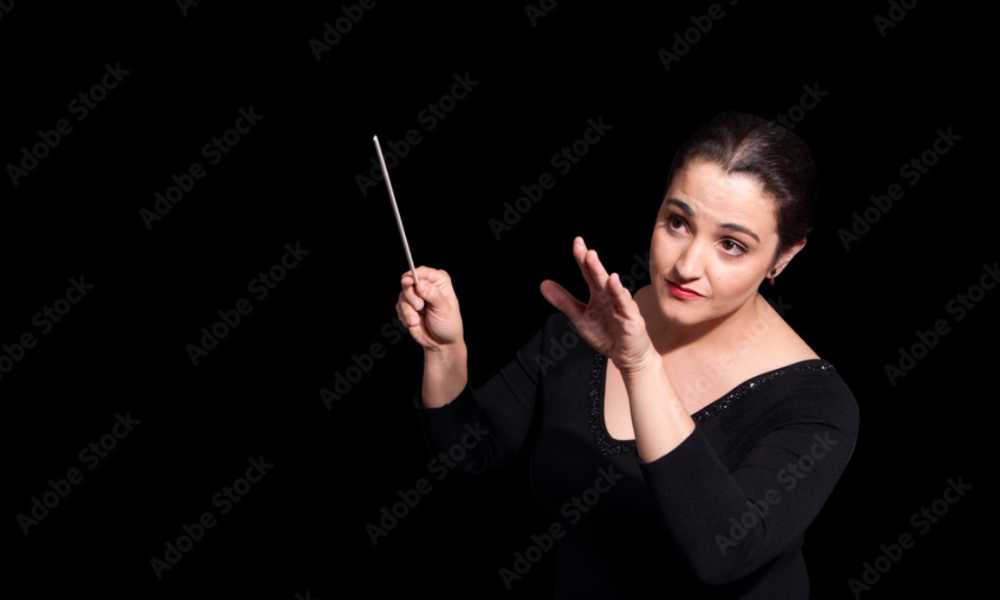 Person conducting holding baton