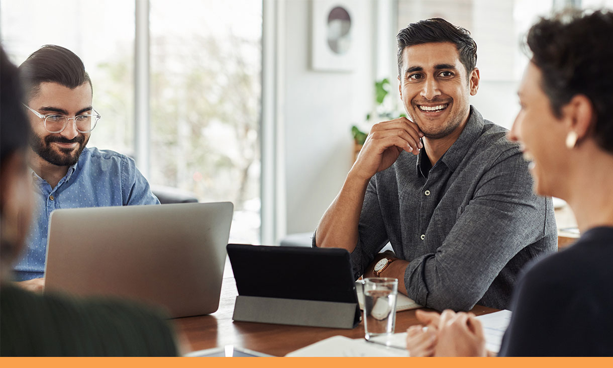 4 coworkers in a meeting.