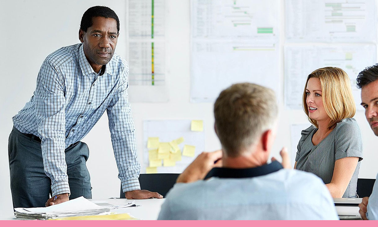 4 people in a meeting.