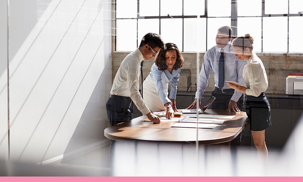 4 people in a meeting.