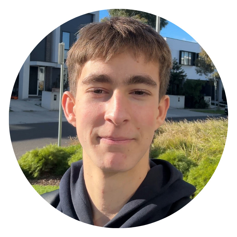 Male student with short brown hair looking at camera.