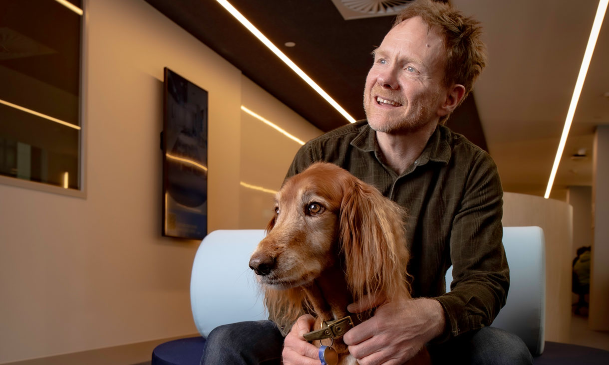 Student Experience Manager Matt Cox and Ziggy the Therapy Dog