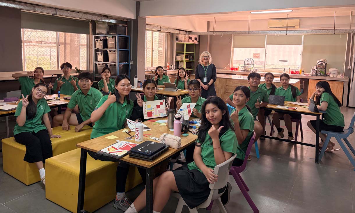 Students smiling in a art demonstration class for RMIT UP in South East Asia